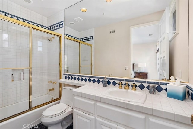 bathroom with shower / bath combination with glass door, tasteful backsplash, visible vents, toilet, and vanity