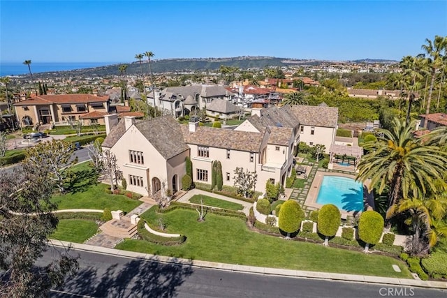 birds eye view of property with a residential view