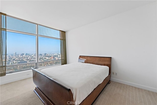 bedroom with light colored carpet