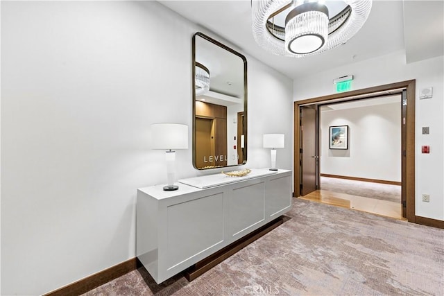 bathroom featuring an inviting chandelier