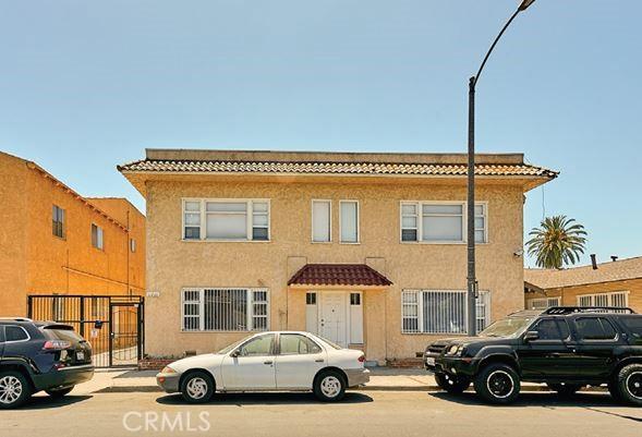 view of front facade featuring a tile roof and stucco siding