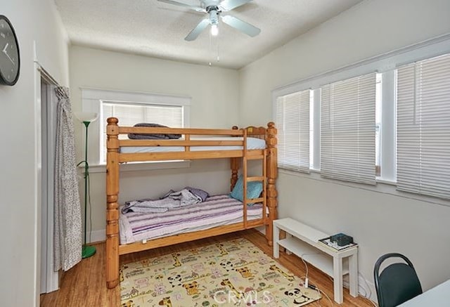 bedroom featuring light hardwood / wood-style floors and ceiling fan