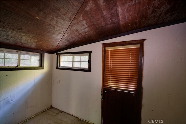 empty room featuring lofted ceiling