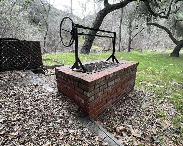 exterior details featuring an outdoor fire pit