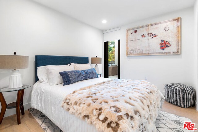 bedroom with light wood-type flooring