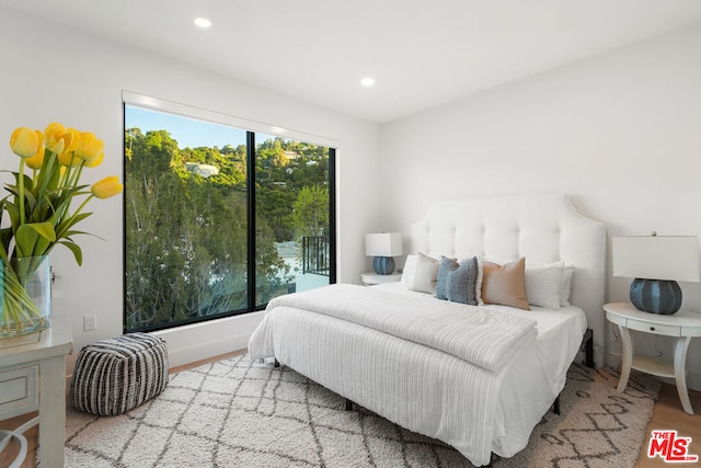 bedroom with light hardwood / wood-style flooring