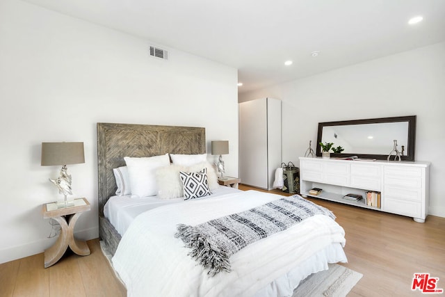 bedroom featuring light hardwood / wood-style flooring