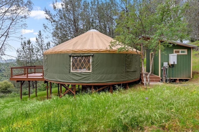 view of property exterior featuring a wooden deck