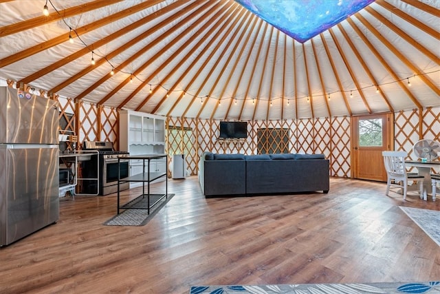 interior space with wood-type flooring and lofted ceiling