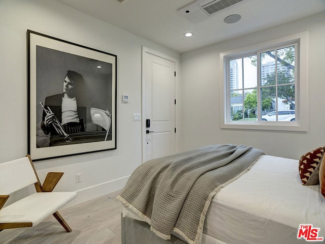 bedroom featuring light hardwood / wood-style floors