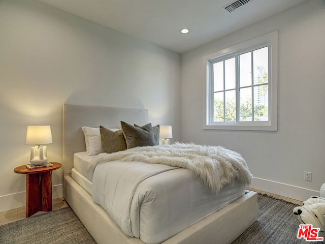 bedroom featuring dark wood-type flooring