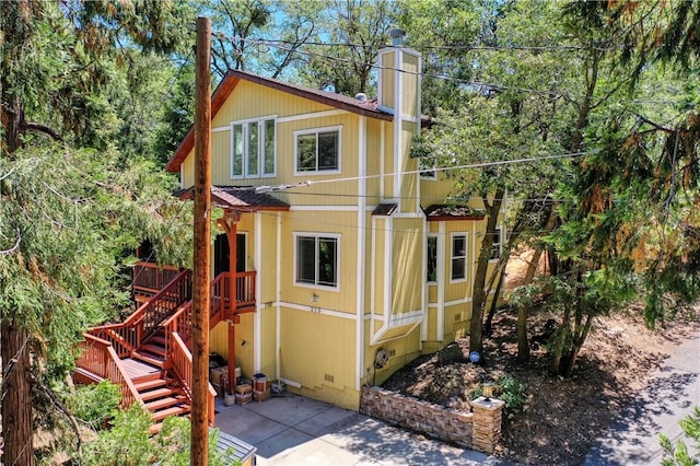 view of outbuilding with stairs