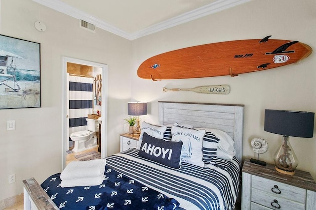 bedroom featuring connected bathroom and crown molding