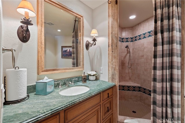 bathroom with vanity and a shower with shower curtain