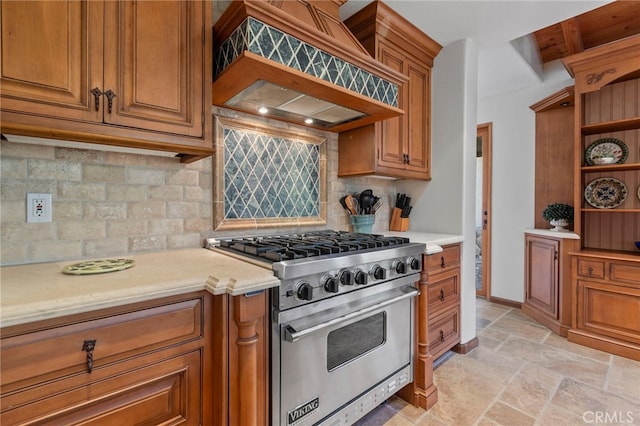 kitchen featuring tasteful backsplash, beamed ceiling, custom range hood, and luxury range