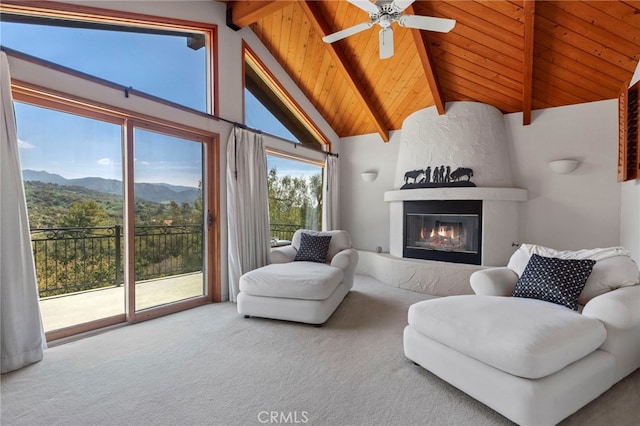 living room featuring high vaulted ceiling, wooden ceiling, a mountain view, carpet floors, and beamed ceiling