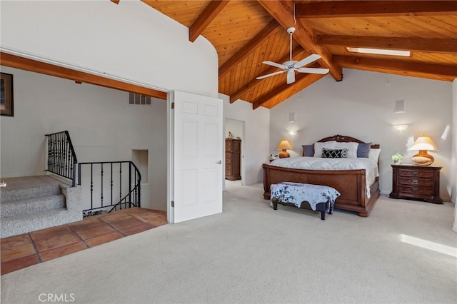 bedroom featuring beamed ceiling, light colored carpet, wood ceiling, and high vaulted ceiling