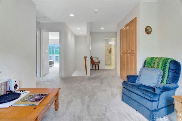 sitting room with light colored carpet