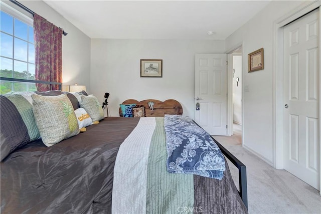 bedroom with light colored carpet