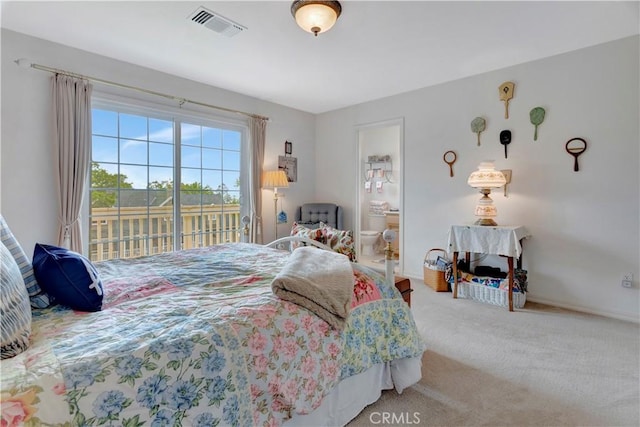 bedroom with carpet and access to exterior