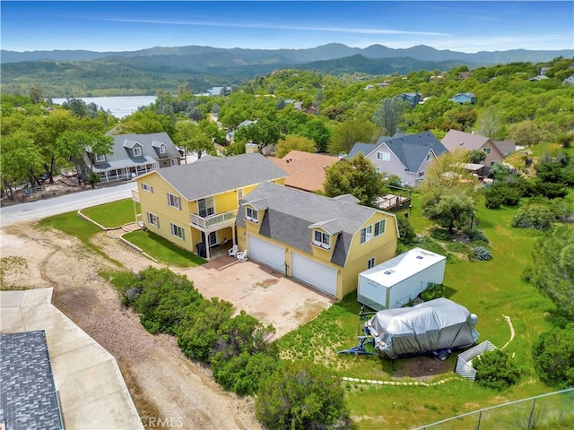 birds eye view of property featuring a water and mountain view