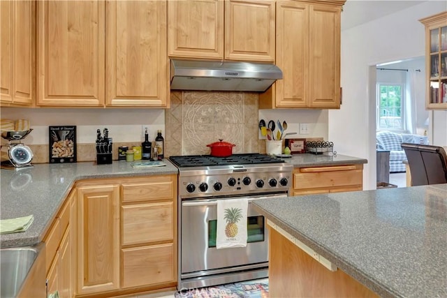 kitchen with light brown cabinetry and high end stainless steel range oven