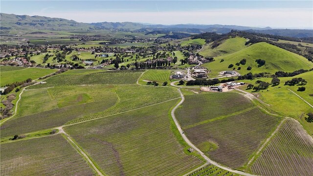 aerial view featuring a rural view and a mountain view