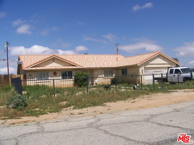 view of front of property featuring a garage