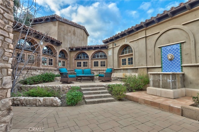 view of home's community featuring a patio