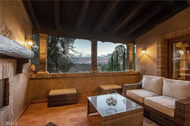 patio terrace at dusk with an outdoor hangout area