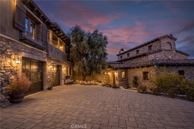 patio terrace at dusk with a balcony