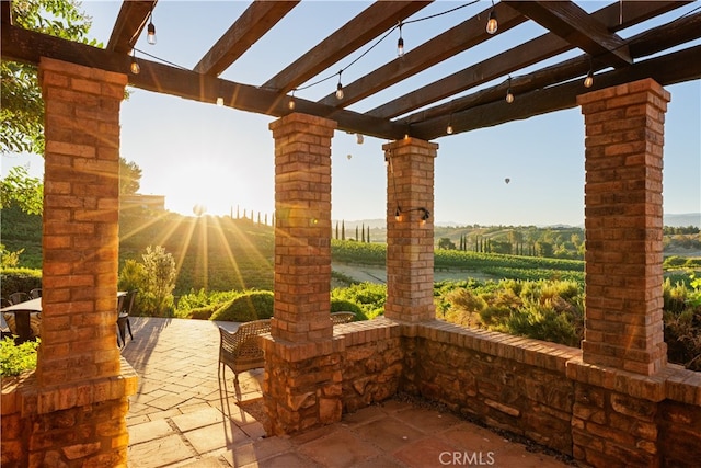 view of terrace featuring a pergola