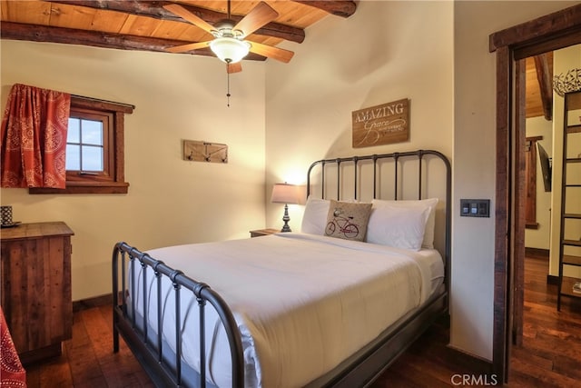 bedroom with beam ceiling, dark wood-type flooring, and wood ceiling