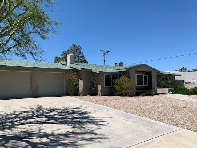 single story home featuring a garage