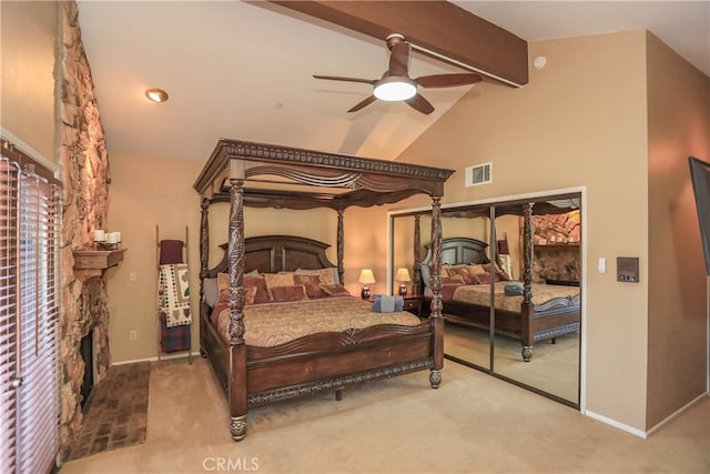 bedroom featuring ceiling fan, lofted ceiling with beams, and carpet