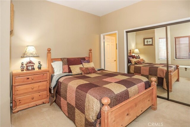 39802 Lakeview Dr Unit 12, Big Bear Lake, CA 92315 - bedroom with light carpet and a closet