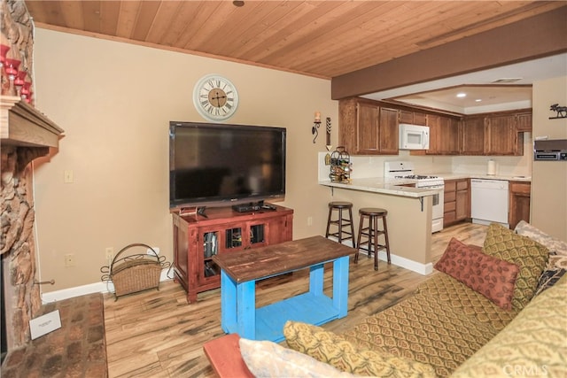 living room with light hardwood / wood-style floors, wood ceiling, a stone fireplace, and crown molding