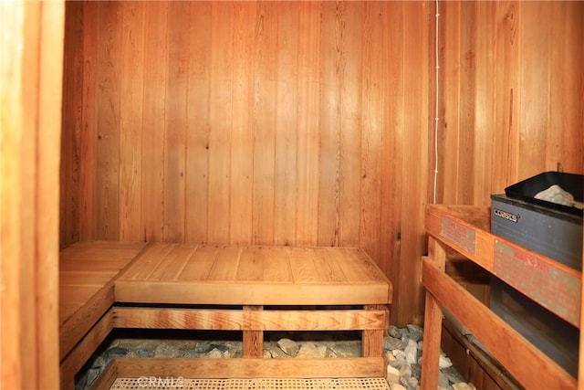 view of sauna featuring wood walls