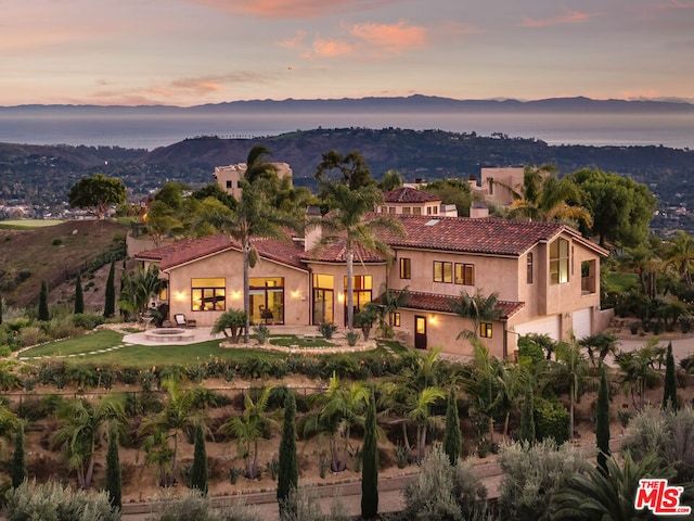 view of front of home featuring a mountain view