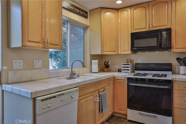 kitchen featuring tile countertops, sink, white appliances, and light brown cabinets