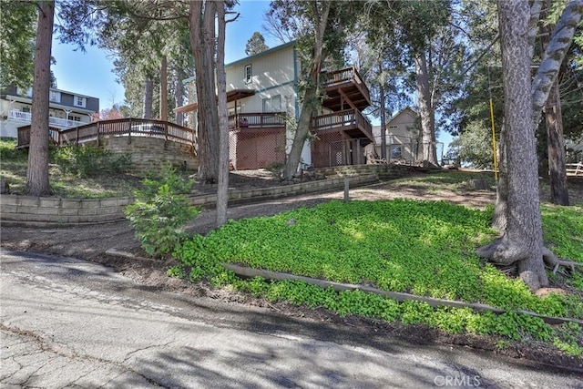 view of yard featuring a wooden deck