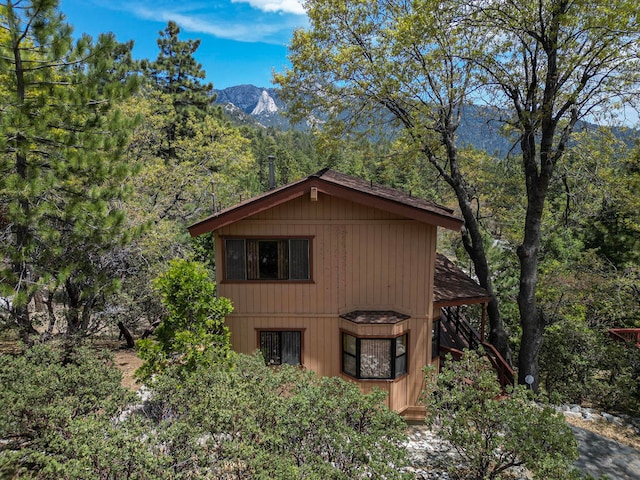 view of outbuilding featuring a mountain view