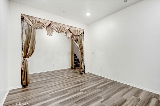 empty room featuring hardwood / wood-style floors