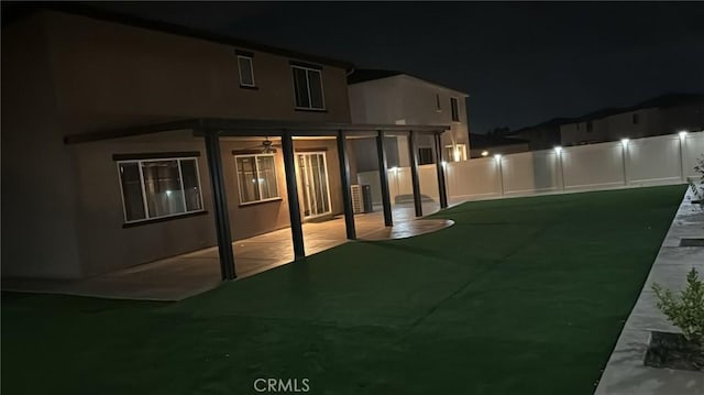 exterior space featuring ceiling fan and a patio area