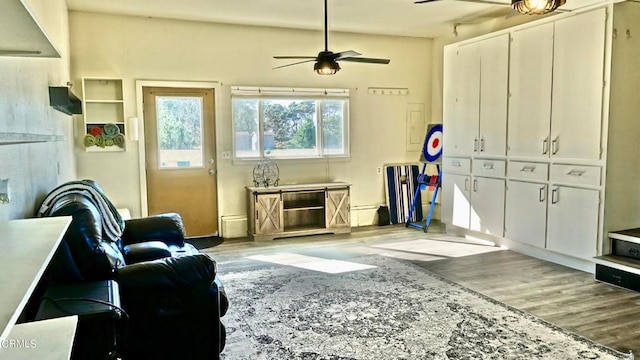 interior space with ceiling fan and hardwood / wood-style floors