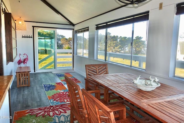 sunroom featuring vaulted ceiling