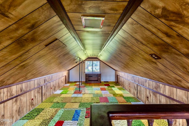 bonus room featuring lofted ceiling, wooden walls, and wood ceiling