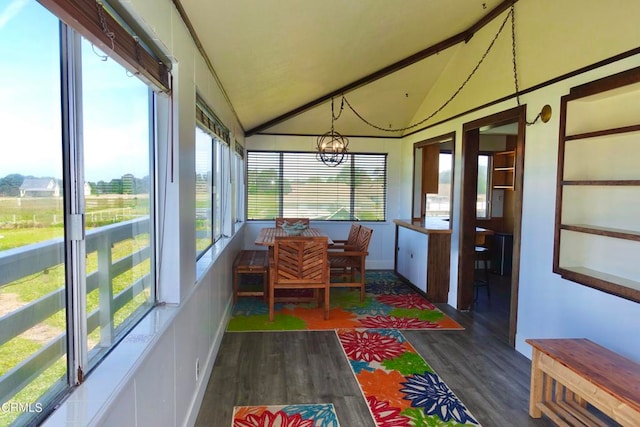 sunroom / solarium with vaulted ceiling