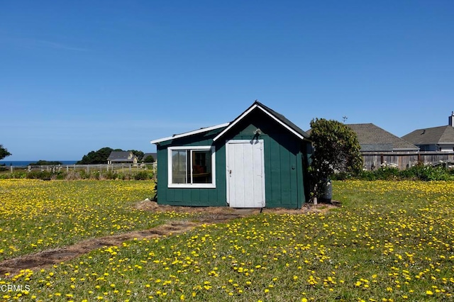 view of outbuilding with a lawn