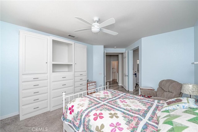 bedroom with ceiling fan, a closet, and carpet flooring